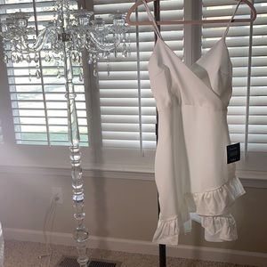 Sealed with a kiss white bodycon dress. By Lulus:  Never worn with Tags.